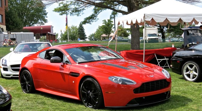 A ruby red Aston Martin V12 Vantage at the Concours of the Americas