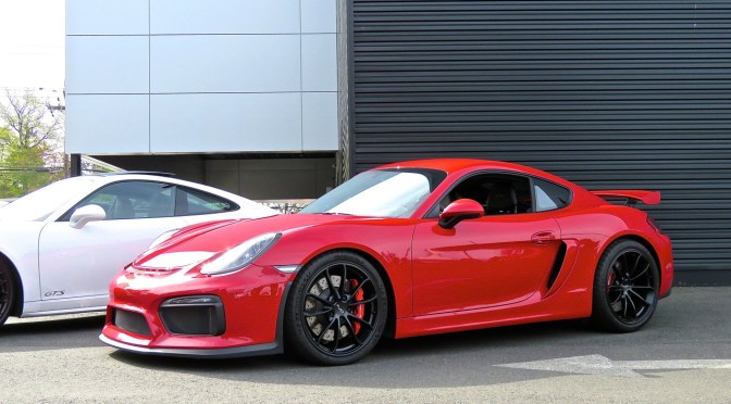 A red Porsche Cayman GT4 at Princeton Porsche Cars and Coffee